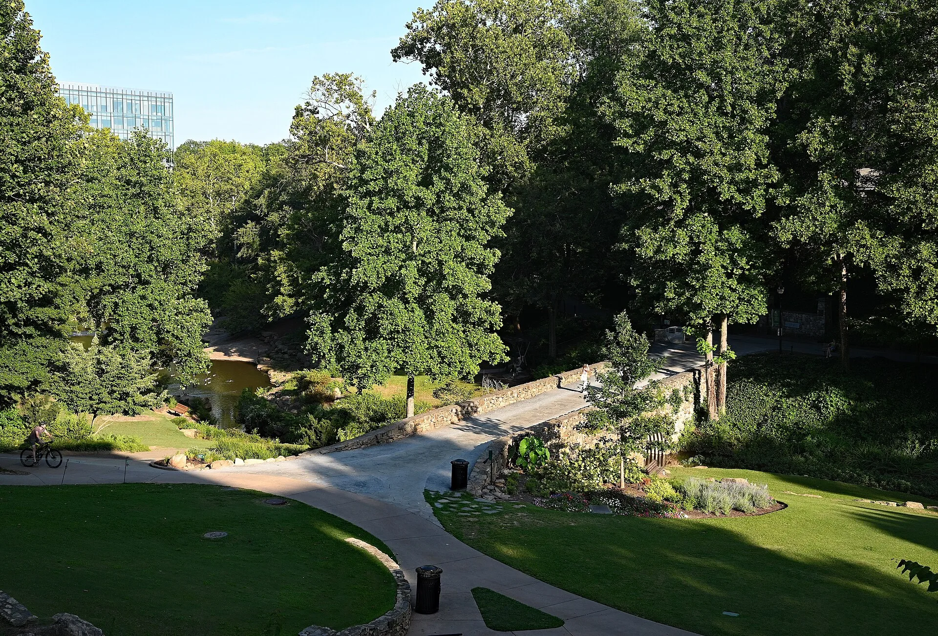 Lawns, curving paths and mature trees in Falls Park on the Reedy in downtown Greenville, South Carolina