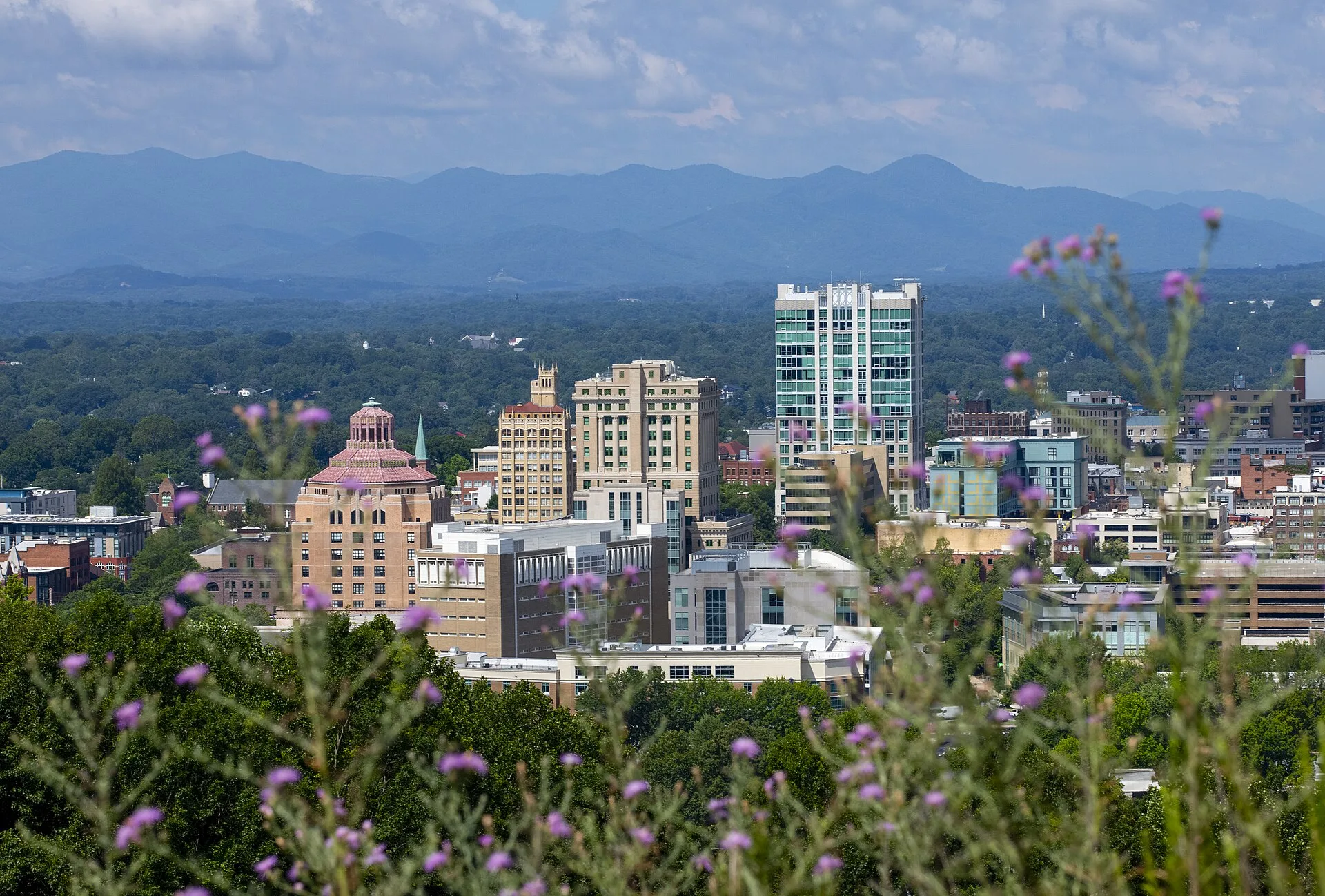 Downtown Asheville, North Carolina with the Blue Ridge Mountains in the distance
